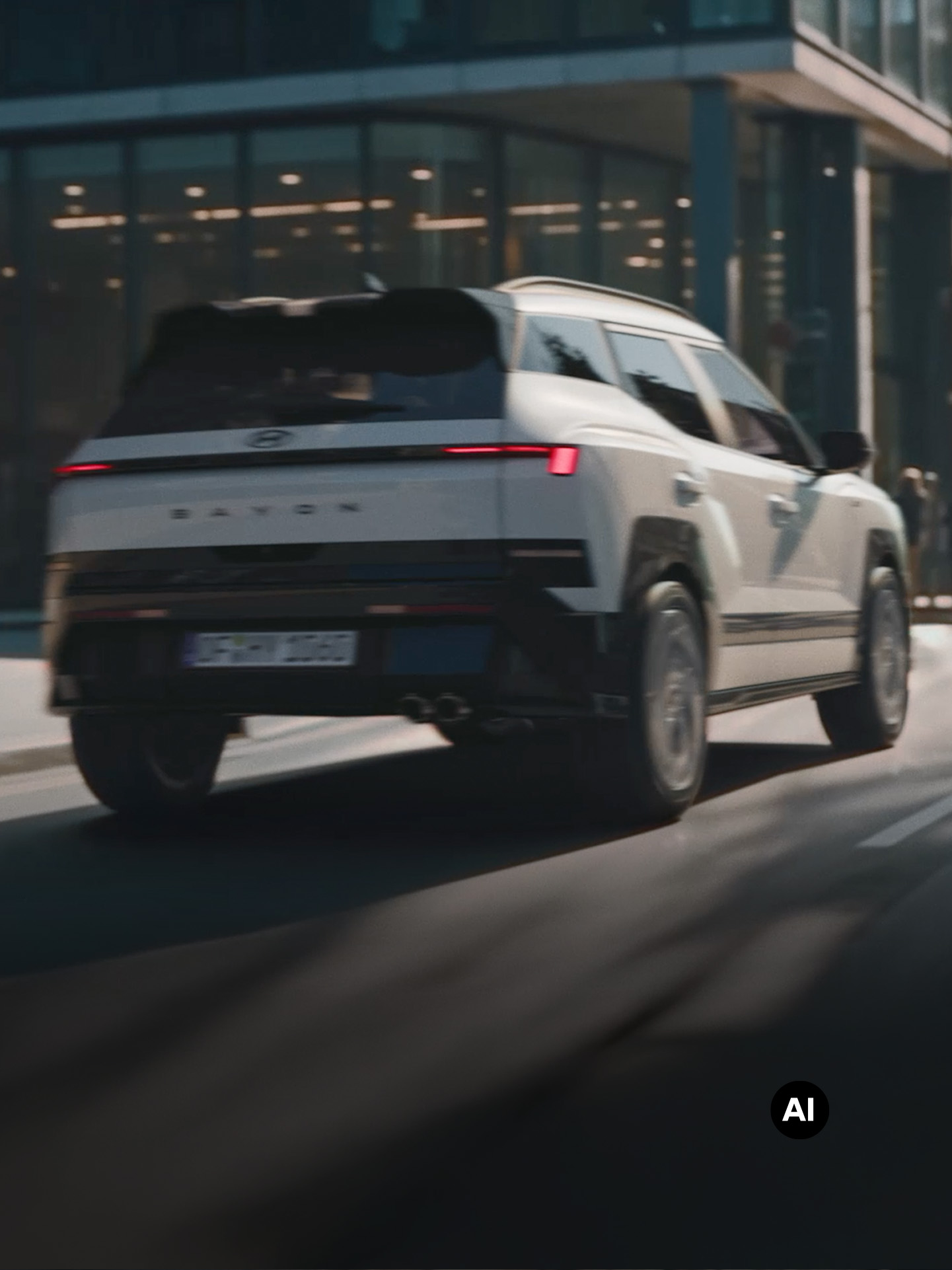 Rear view of Hyundai BAYON N Line driving on the city street.