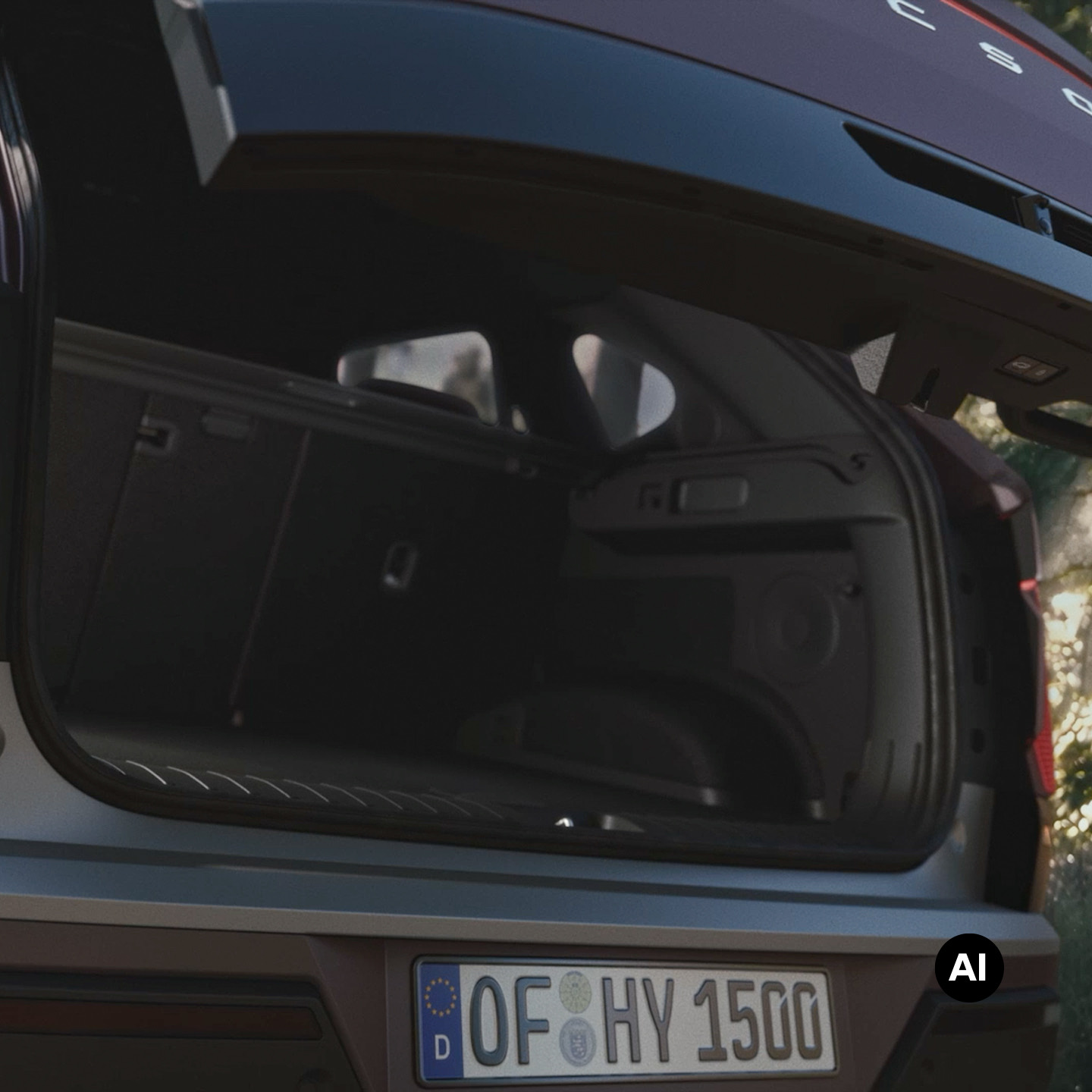 Close-up shot of the Hyundai TUCSON cargo area with the rear trunk open.